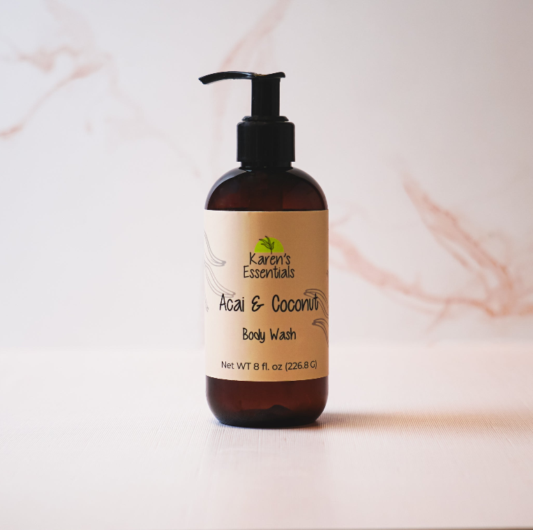 a black bottle with a dark brown tint with a off white label on it, black text of the company name Karen Essentials, Acai & Coconut Body Wash, Net WT 8 fl. oz