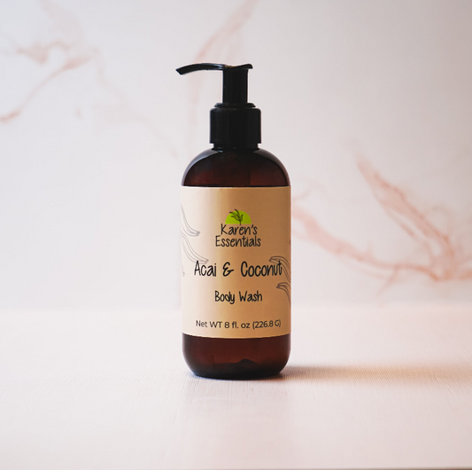 a black bottle with a dark brown tint with a off white label on it, black text of the company name Karen Essentials, Acai & Coconut Body Wash, Net WT 8 fl. oz