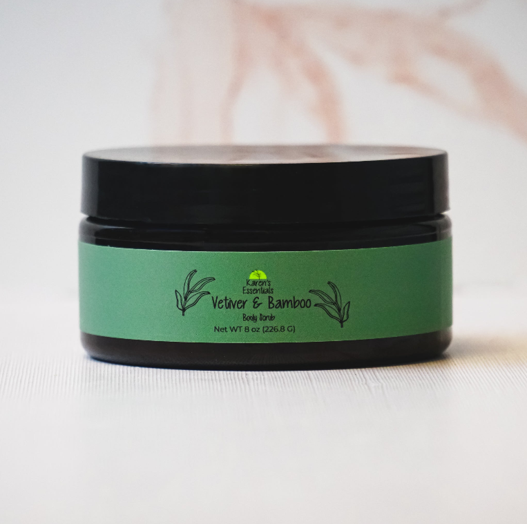 picture of a black jar with a green label on it, with the words Karen Essentials which is the company name. With the wordsVetiver & Bamboo Body Scrub Net WT 8 oz
