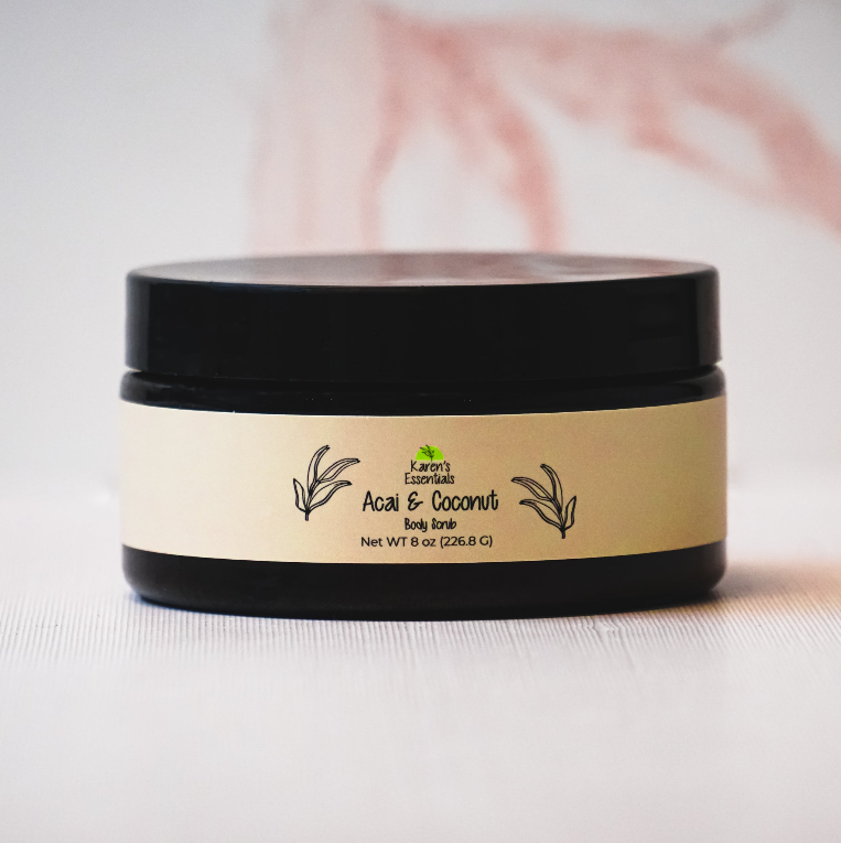 picture of a black jar with a green label on it, with the words Karen Essentials which is the company name. With the words Acai & Coconut Body Scrub  Net WT 8 oz