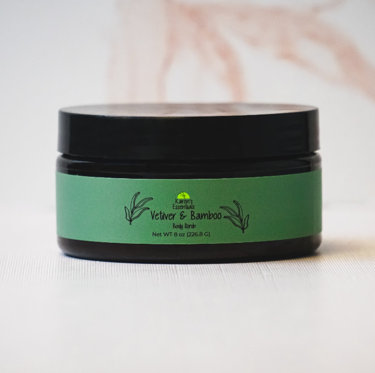 picture of a black jar with a green label on it, with the words Karen Essentials which is the company name. With the wordsVetiver & Bamboo  Body Scrub Net WT 8 oz